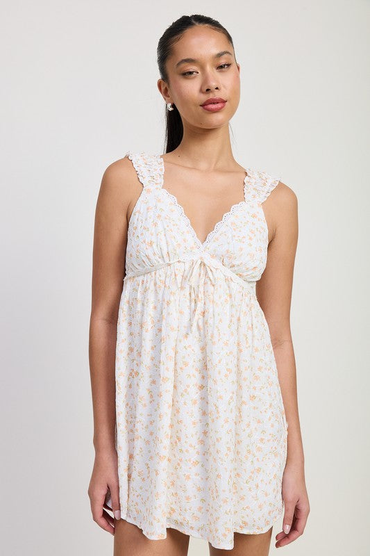 Emory Park Mini Floral Babydoll Puff Straps Dress in white with delicate yellow flowers and ruffled straps