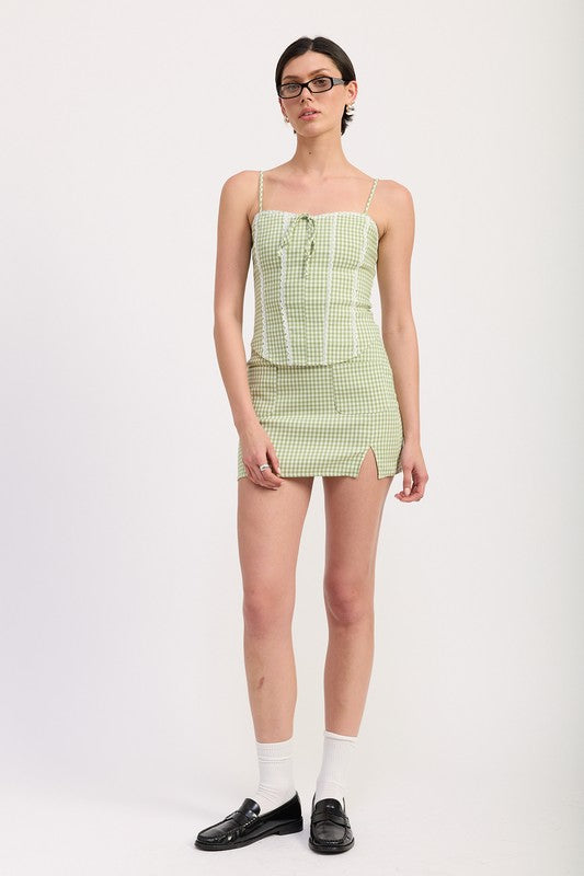Emory Park Mini Gingham Skirt With Pockets in green worn with matching top and black loafers