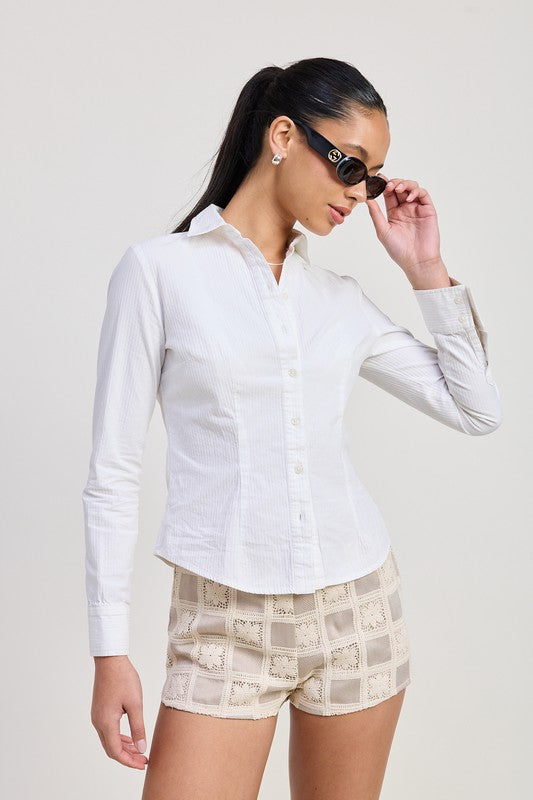Woman wearing Emory Park Mini Jacquard Crochet Shorts with white button-up shirt and sunglasses
