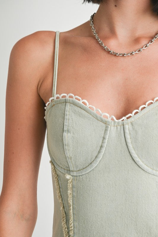 Close-up of Emory Park Mini Sleeveless Denim Dress with delicate white lace trim and thin shoulder straps