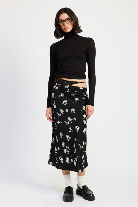 Emory Park Mixe Media Asymmetrical Maxi Satin Skirt in black with white floral print styled with black turtleneck