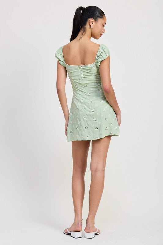 Emory Park Mixed Media Mini Ruched Dress in light green with short puff sleeves and back button details