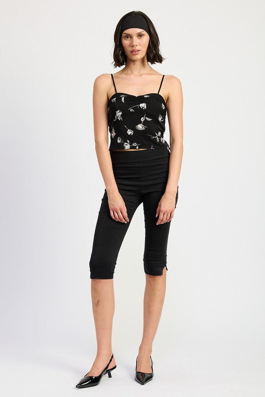 Emory Park Mixed Media Satin Spaghetti Strap Top black floral print worn by model with black pants
