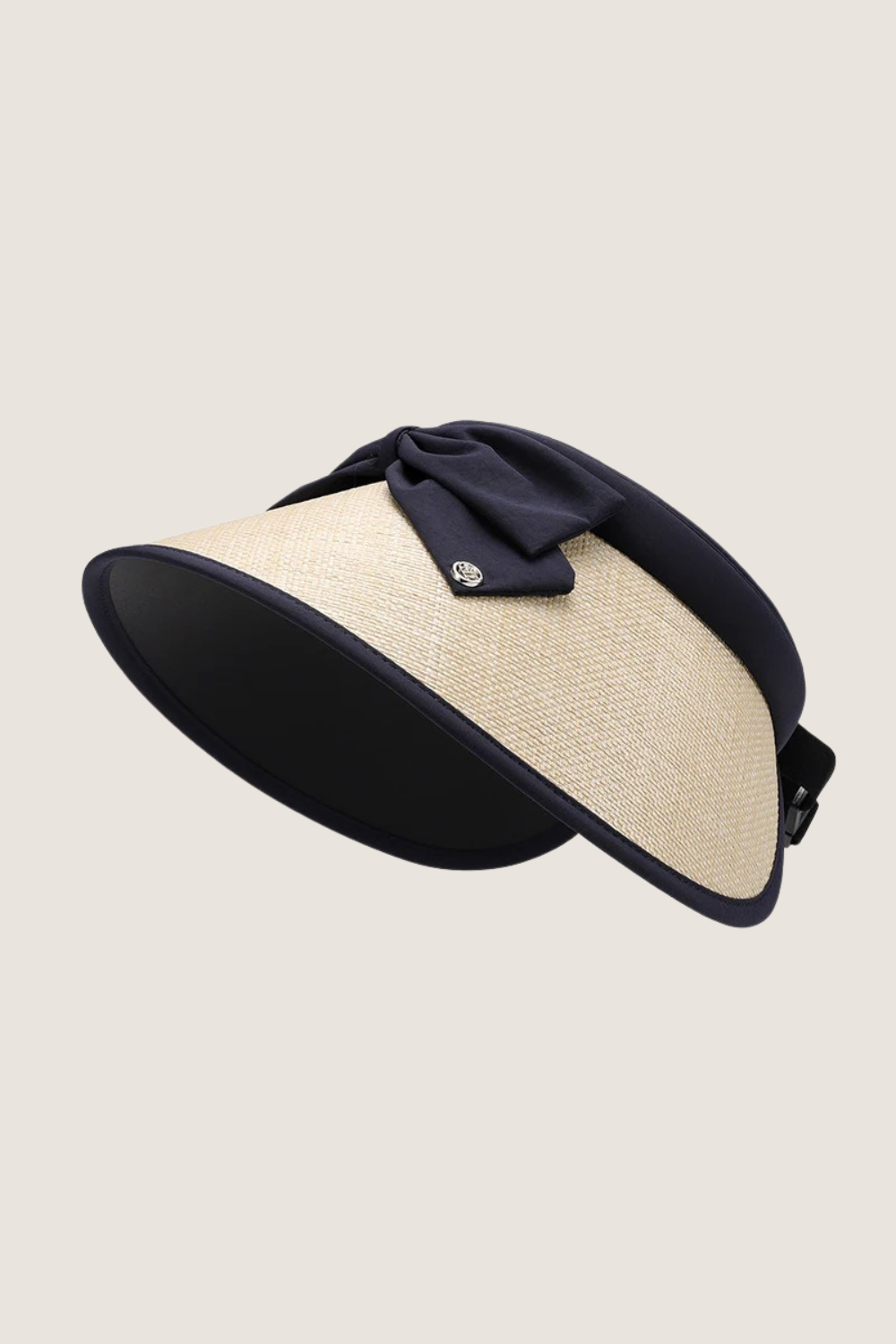 Natural grass wide brim hat with navy ribbon, perfect for sunny outdoor activities