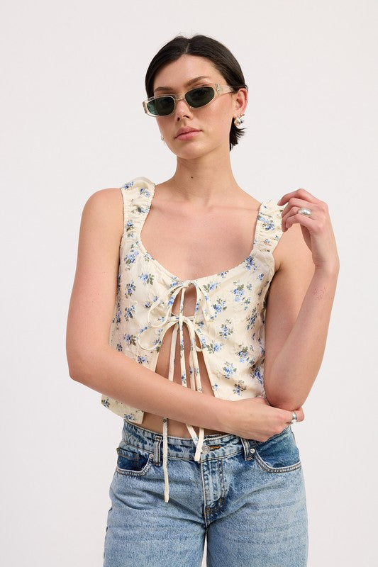 Emory Park Tie Front Peasant Top with blue floral print and multiple front ties worn with denim jeans