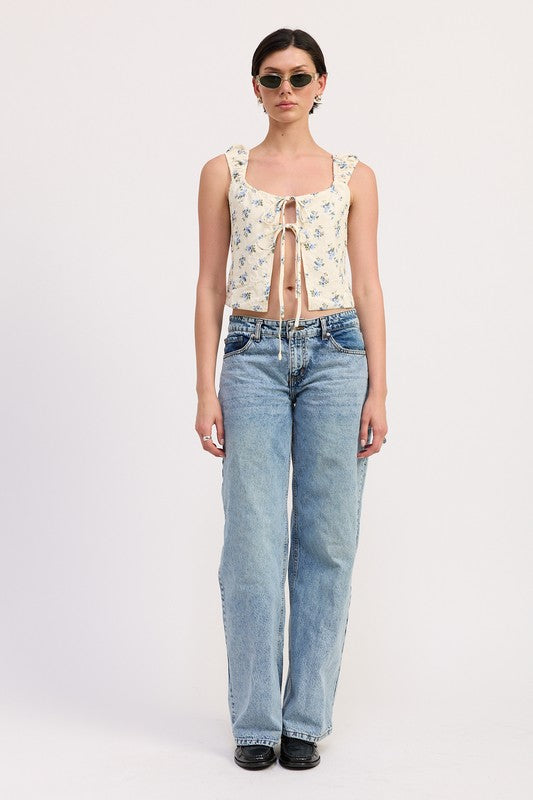 Emory Park Tie Front Peasant Top in floral print paired with light wash jeans and sunglasses