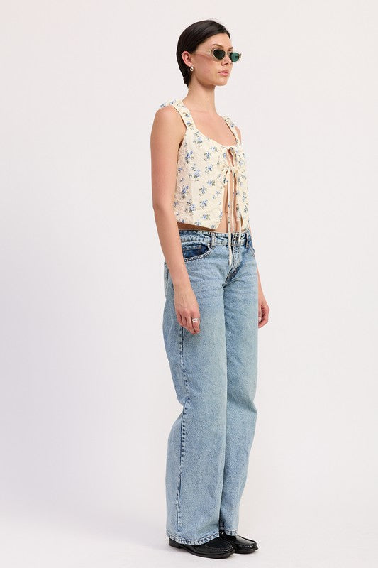 Emory Park Tie Front Peasant Top in floral print worn with light wash jeans and sunglasses