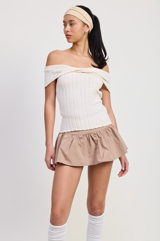 Emory Park off shoulder sweater top in white ribbed knit worn with beige skirt and headband
