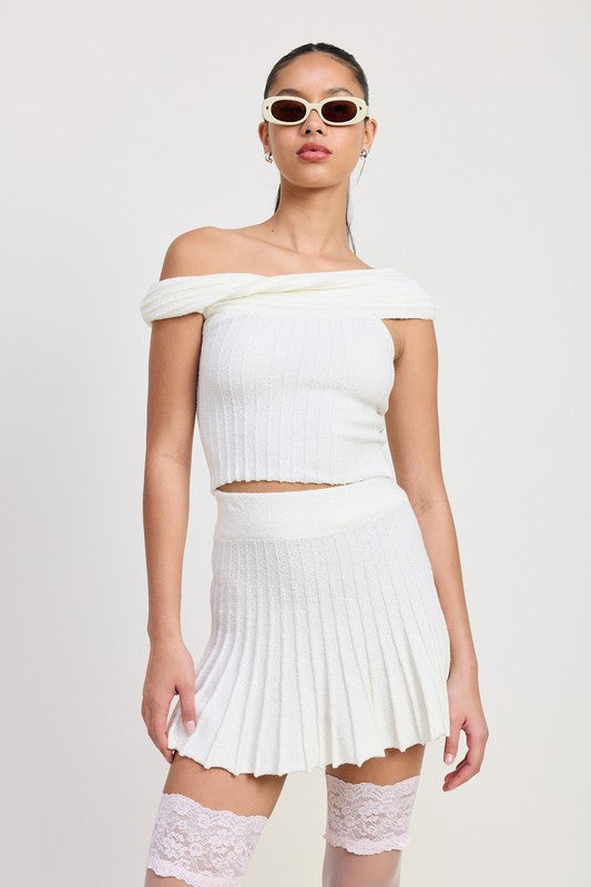 Emory Park white Off The Shoulder Knit Top with ribbed texture worn with matching pleated skirt and sunglasses