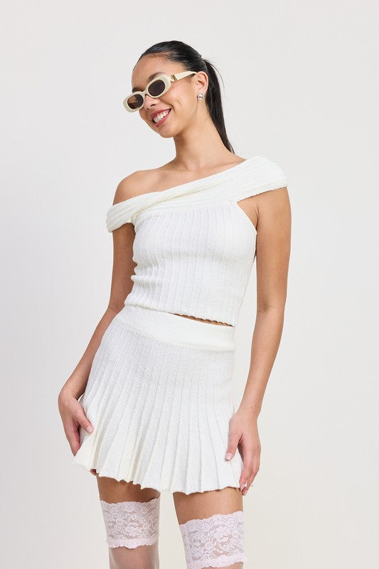 Emory Park off the shoulder knit top in white worn with matching skirt and sunglasses