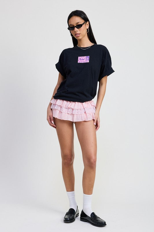Emory Park Gingham Mini Ruffle Skort in pink with layered ruffles worn with black t-shirt and loafers