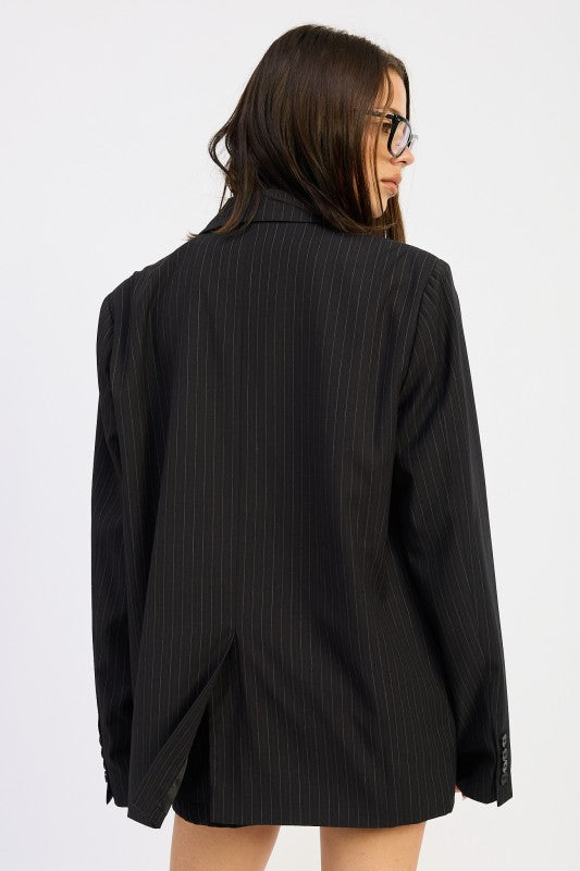 Back view of Emory Park Pinstripe Oversize Blazer featuring a relaxed fit and classic pinstripe pattern