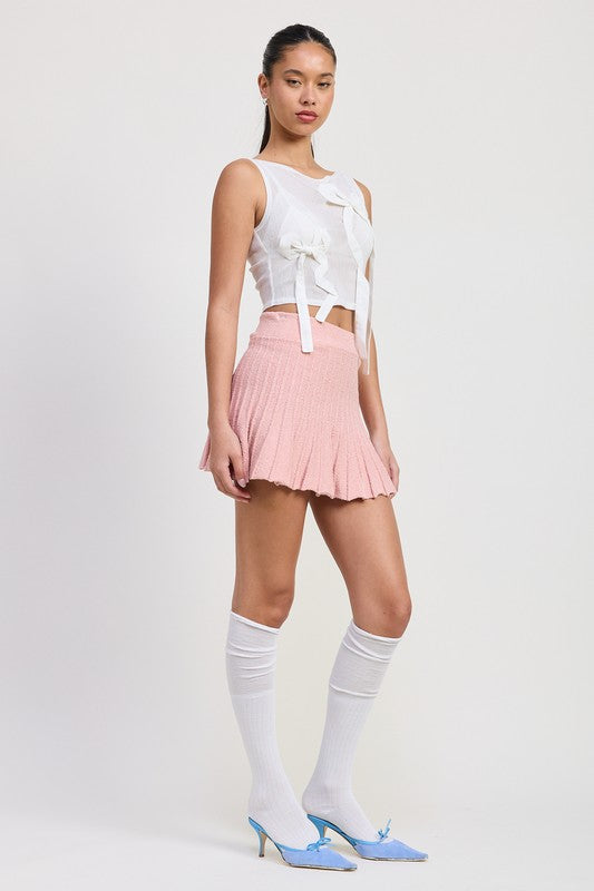Emory Park pink Pleated Mini Skirt worn with white sleeveless top and knee-high socks