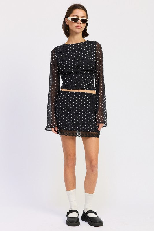 Emory Park Polka Dot Mini Lace Skirt paired with a matching top and stylish sunglasses