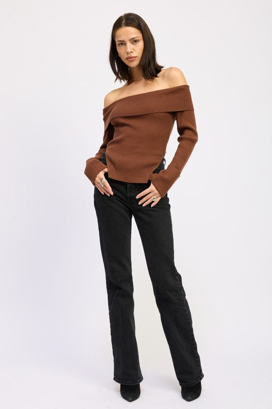 Model wearing Emory Park Ribbed Off-Shoulder Sweater With Zipper in brown paired with black jeans
