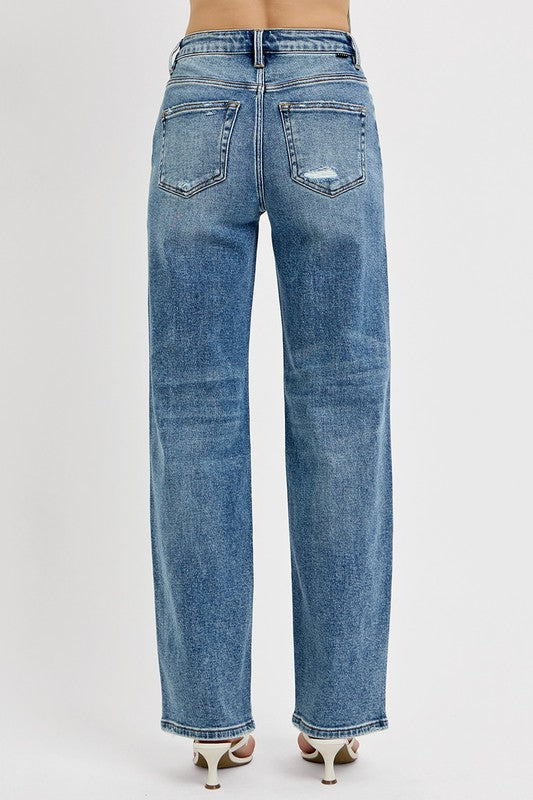 Back view of RISEN Distressed Wide Leg Jeans in light blue denim with a relaxed fit