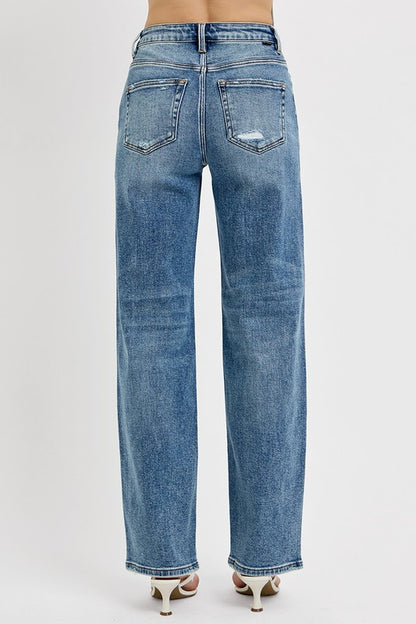 Back view of RISEN Distressed Wide Leg Jeans in light blue denim with a relaxed fit