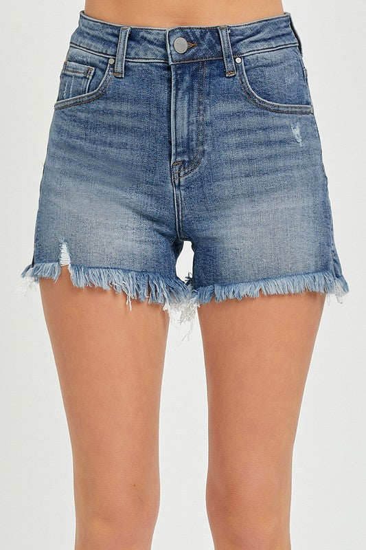 RISEN High Rise Side Slit Shorts in light blue denim with frayed hem and distressed details