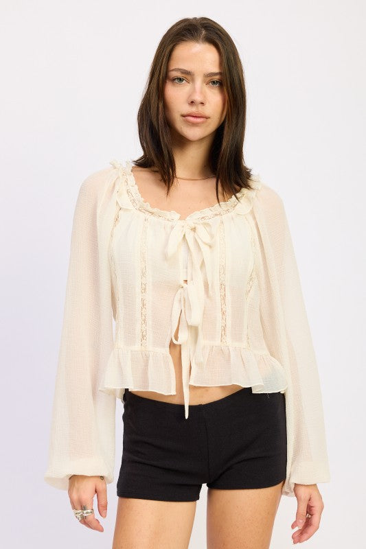 Emory Park Round Neck Long Sleeve Flared Blouse in Cream with Ruffle Details and Tie Front Design