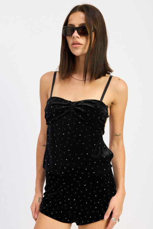 Model wearing Emory Park Ruched Velvet Top With Rhinestones, featuring a stylish design and adjustable straps