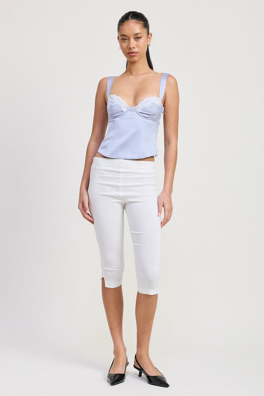 Emory Park Satin Bustier Top With Lace Detail in light blue worn with white cropped pants and black heels pose