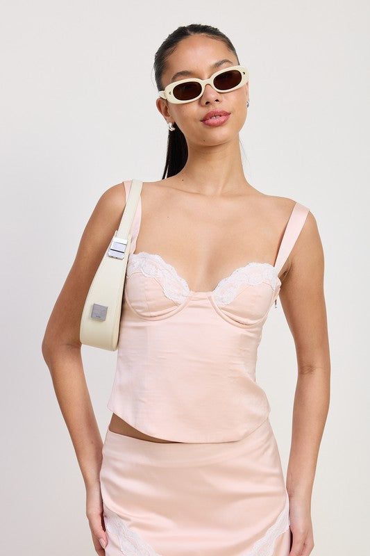 Emory Park Satin Bustier Top With Lace Detail in blush pink worn by model with sunglasses and shoulder bag