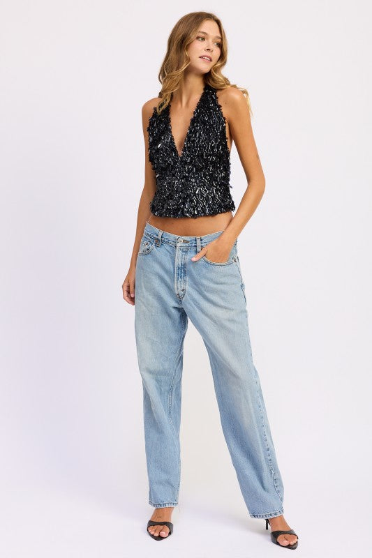 Emory Park Sequin Pailette Halter Top in black paired with relaxed fit jeans for a stylish look