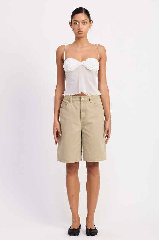 Model wearing Emory Park Sheer Mesh Floral Cup Cami Top in white paired with beige knee length shorts and black flats