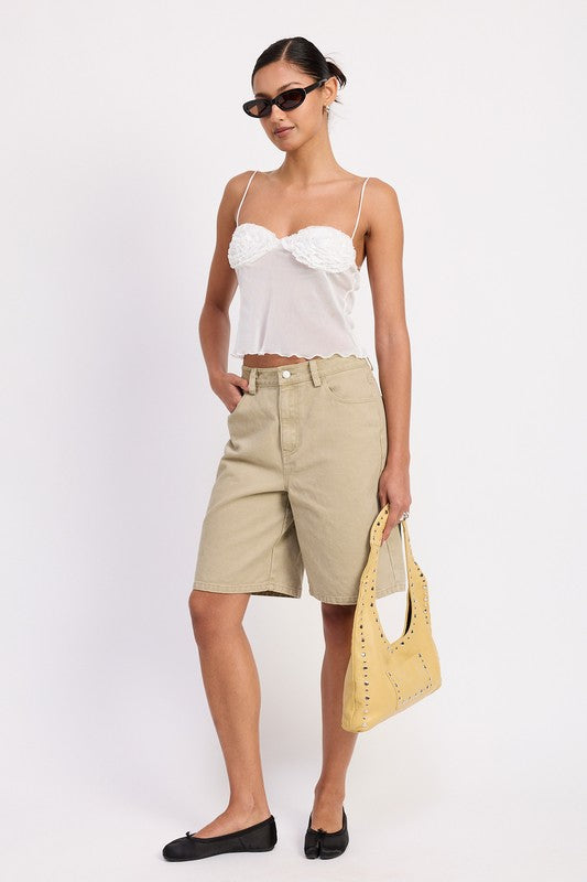 Model wearing Emory Park Sheer Mesh Floral Cup Cami Top in white with beige bermuda shorts yellow handbag