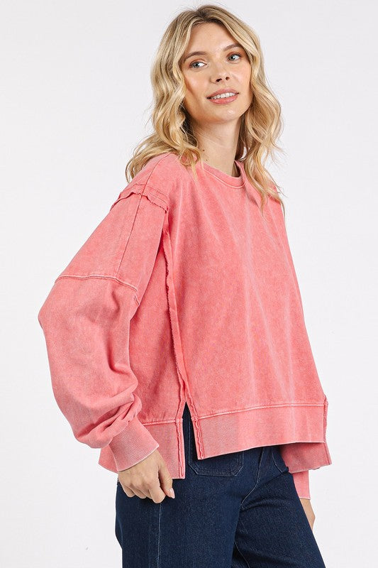 Side Slide Exposed Seam Sweatshirt in pink with relaxed fit and unique side seam detailing