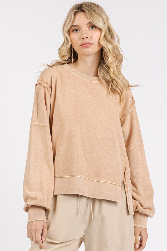 Side Slit Exposed Seam Sweatshirt in beige fabric with casual oversized fit and stylish side slits