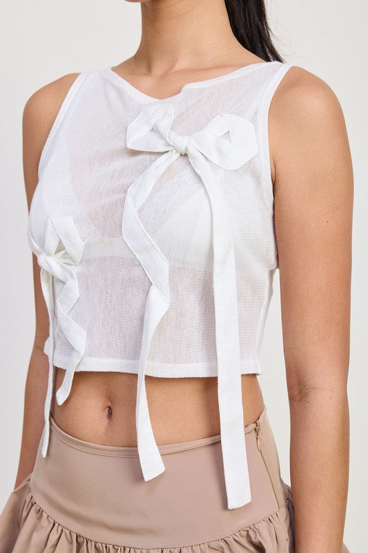 Emory Park sleeveless sheer bow top in white with large decorative bows and lightweight fabric