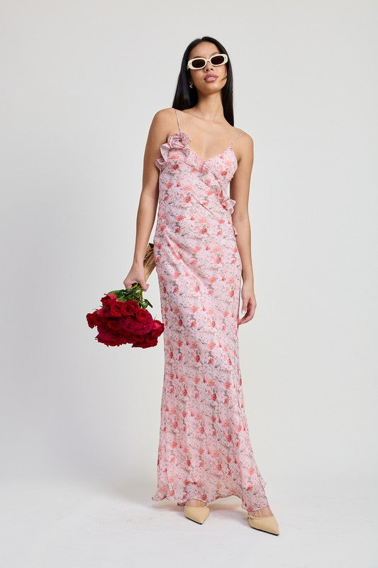 Emory Park pink floral Spaghetti Strap Maxi Dress with ruffle details worn by woman holding red roses