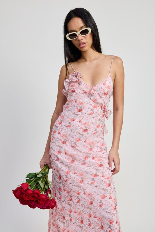 Emory Park pink floral spaghetti strap maxi dress with ruffle details worn by model holding red roses