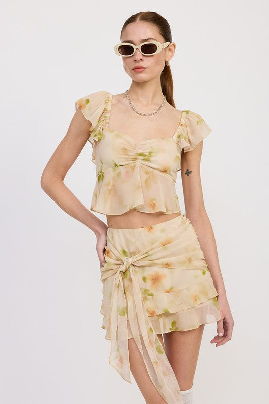 Emory Park floral squared neck top with cap sleeves paired with matching skirt and sunglasses