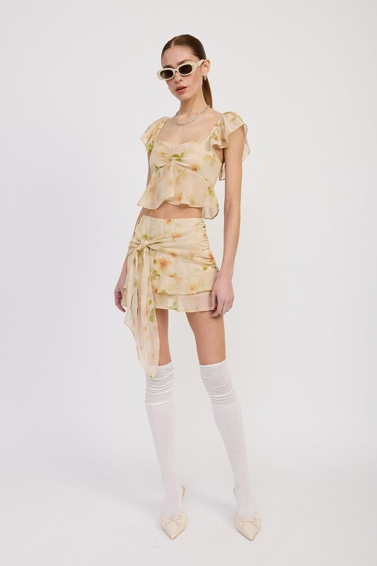 Emory Park squared neck top with cap sleeves in light floral print paired with matching mini skirt and white knee-high socks
