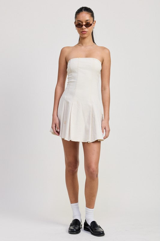 Emory Park Strapless Mini Ruffle Dress in white worn with sunglasses and black loafers