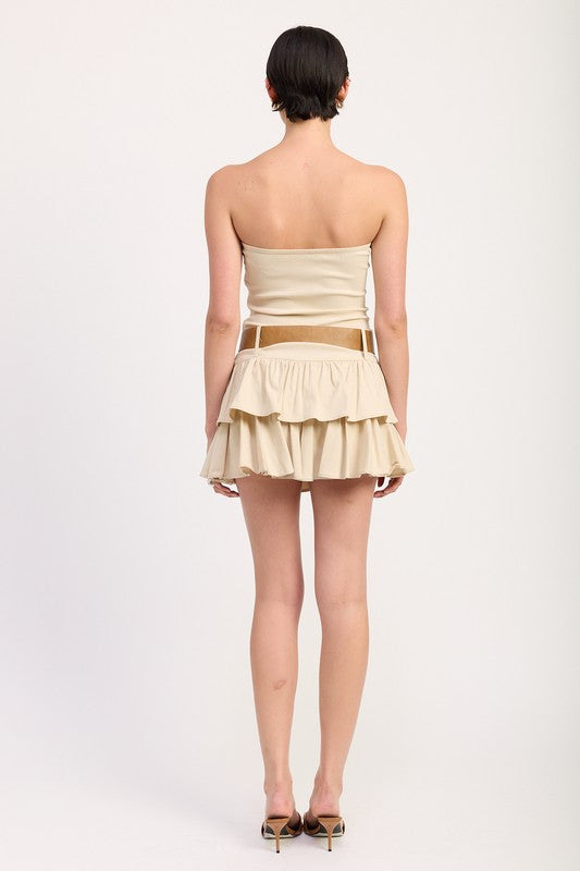 Back view of Emory Park strapless tiered mini dress with belt in beige on model