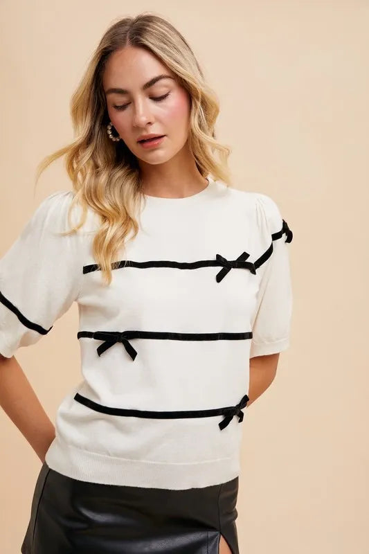 Striped Bow Knit Top in white with black ribbon details for a stylish look