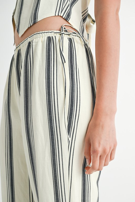 Emory Park striped straight leg pants in cream with black vertical stripes and adjustable waist tie