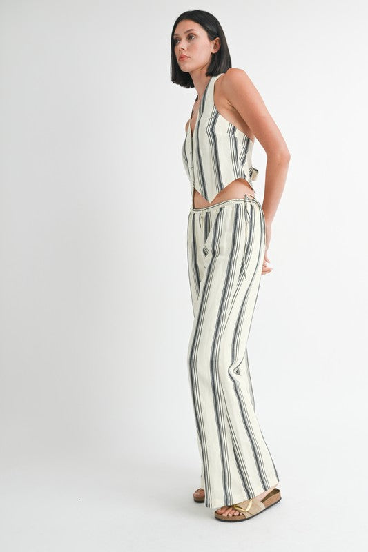 Emory Park striped straight leg pants worn by woman paired with matching sleeveless top