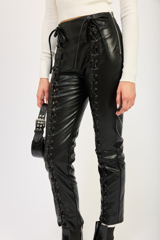 Emory Park model wearing black Lace-Up Leather Trousers high waist side laced panels with ankle boots