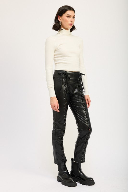 Emory Park Lace-Up Leather Trousers on model styled with white turtleneck and black chunky boots