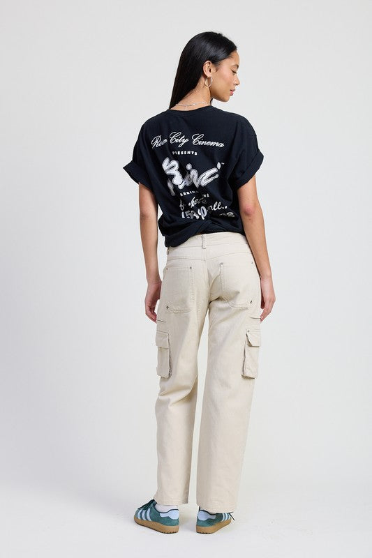 Emory Park model wearing beige high waisted Pocket Cargo Pants with side flap pockets back view