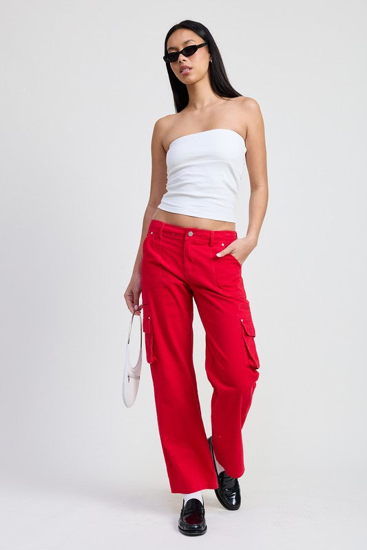 Emory Park model wearing red Pocket Cargo Pants with side flap pockets white tube top and black loafers