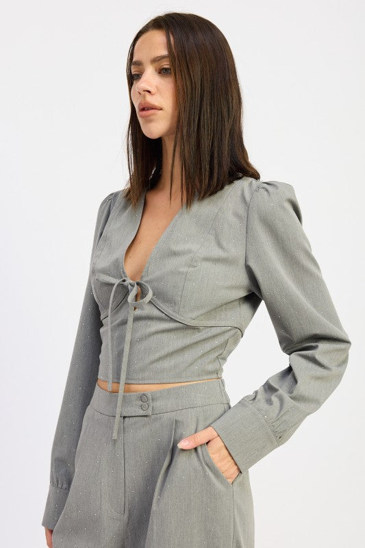 Emory Park V-Neck Cropped Blouse With Rhinestones in gray, featuring a tie front and long sleeves