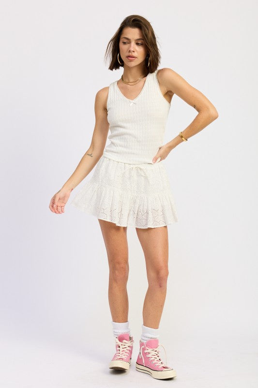 Emory Park V-Neck Sleeveless Rib Tank Top styled with a lace skirt and pink sneakers