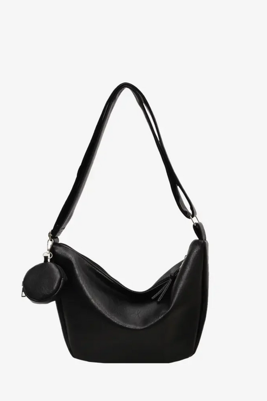 Vegan Leather Crossbody Bag in Black with a stylish curved design and matching coin purse