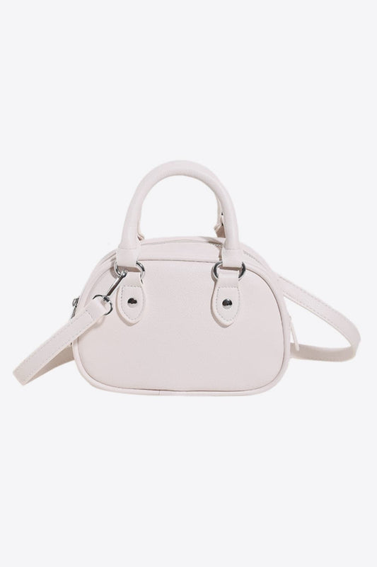 Vegan Leather Crossbody Bag in Light Pink with Adjustable Strap and Stylish Design