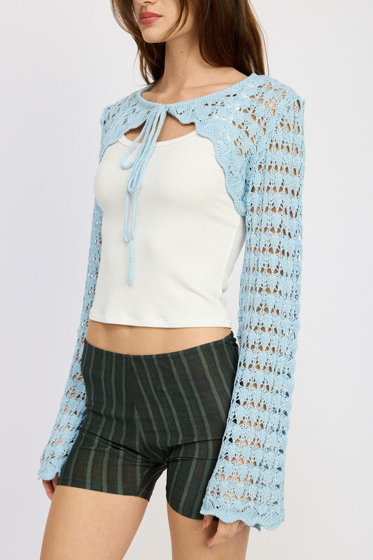 Emory Park light blue Crochet Bolero With Drawstrings worn over white tank top and striped shorts close up